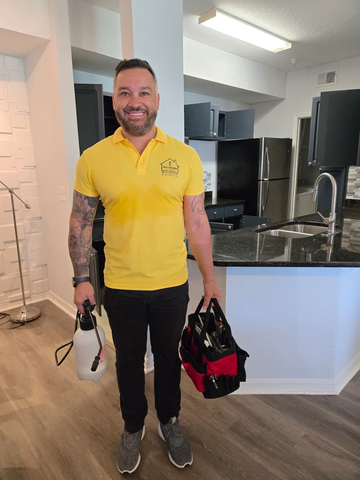 Arcalyde technician treating a kitchen for pests